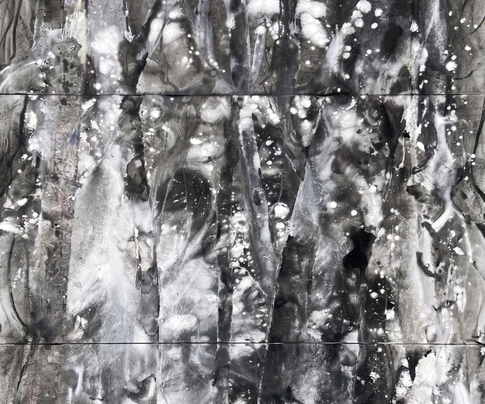 A monochrome gestural painting on multiple joined sheets — bold dark strokes and white splashes across a near-black ground.