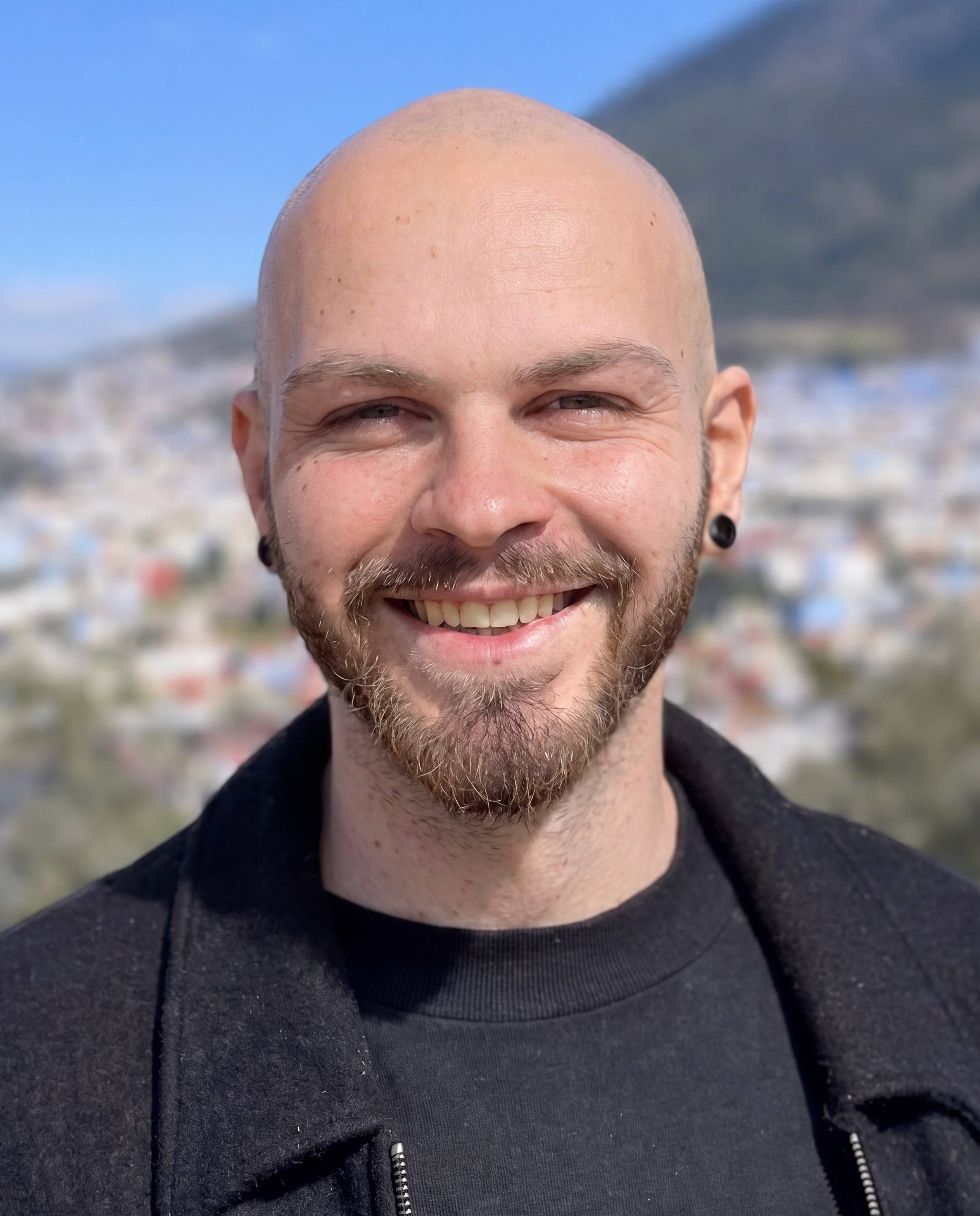 Portrait of Arun Viglietti — assistant facilitator, looking toward the camera.