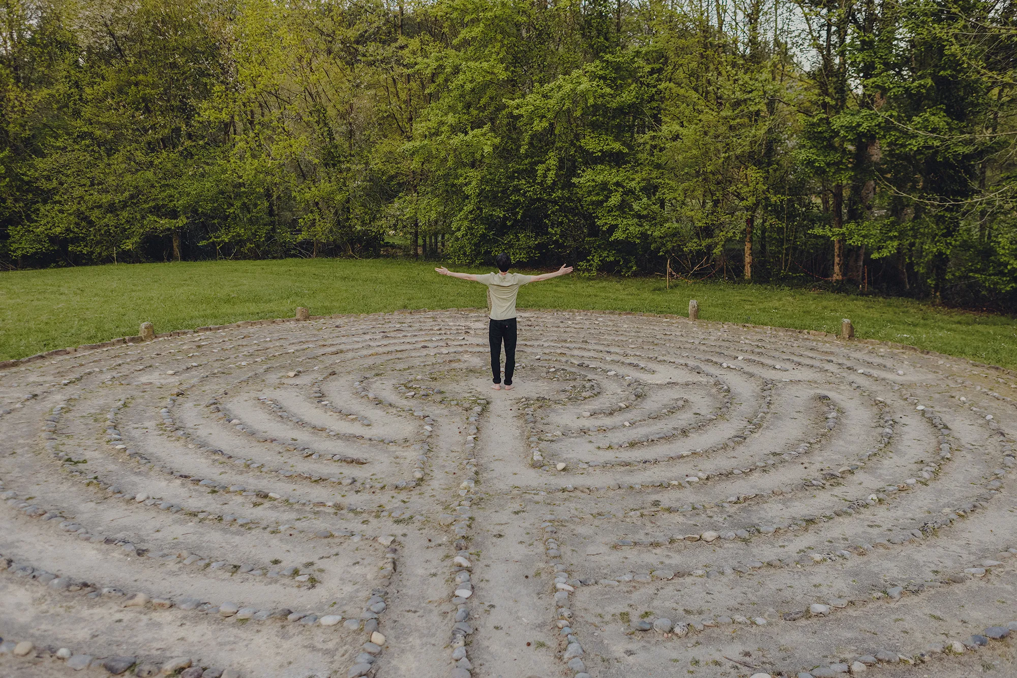 A stone labyrinth laid out on the grass at Amalurra.