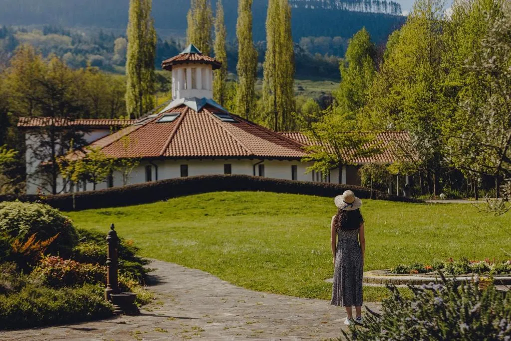Wide panoramic view of Amalurra EcoHotel set against the Basque mountain valley.