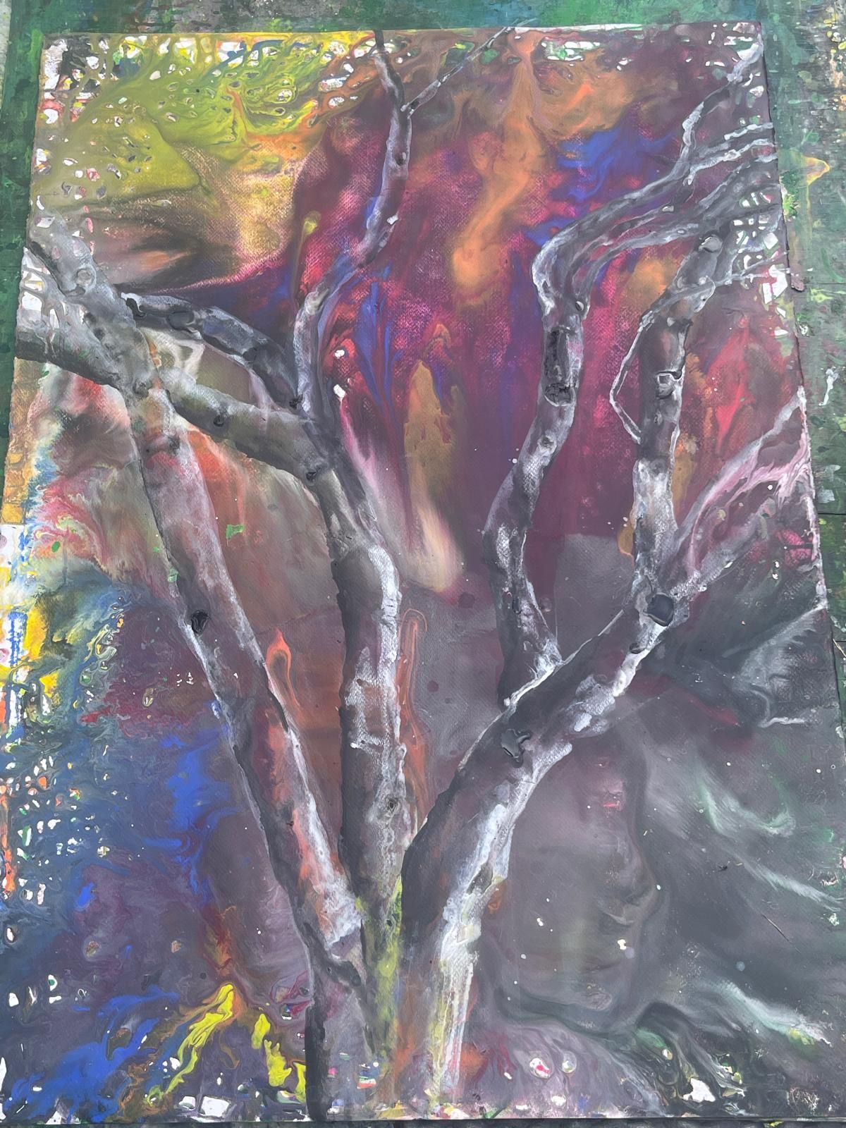 A dark, moody painting on paper — bare trees against an indigo wash.